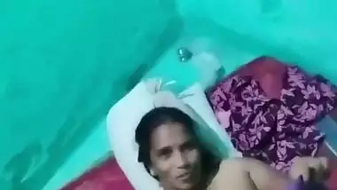 Village sex of a wife putting a condom on dick before sex