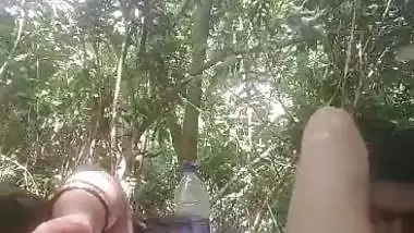 Mistress lets her servant lick her pussy during outdoor sex