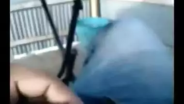 Indian girlfriend gives a blowjob on the balcony.