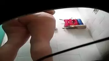 Hidden camera films naked XXX Indian girl taking a shower in a sex way