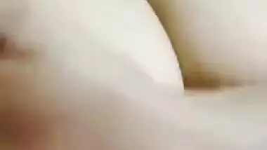 Desi woman in floral robe teases lover demonstrating big breasts